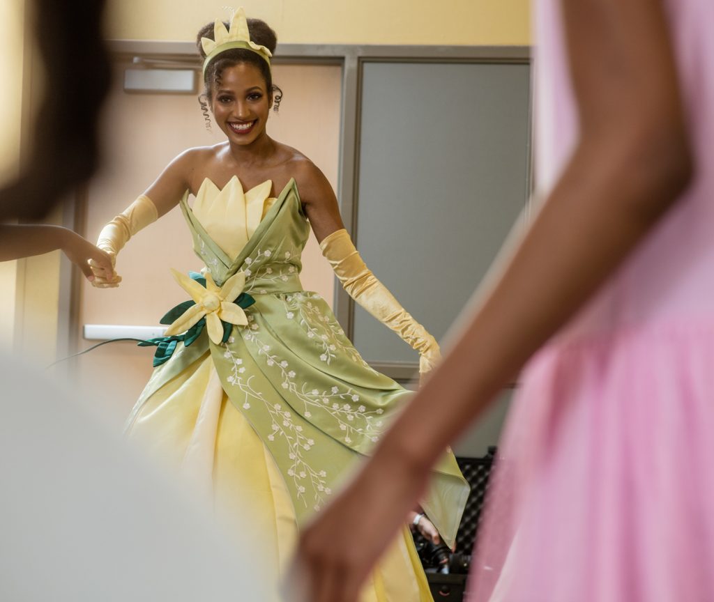 The New Orleans Princess dancing with children at a birthday party.